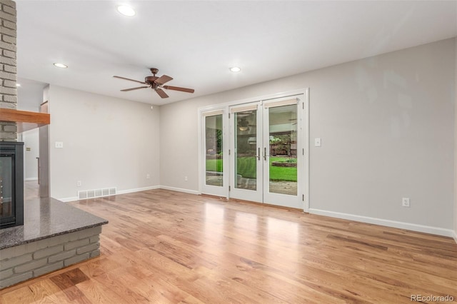 3 Glenview Dr, Littleton, CO 80123 - unfurnished living room featuring a multi sided fireplace, light wood-style flooring, recessed lighting, baseboards, and ceiling fan