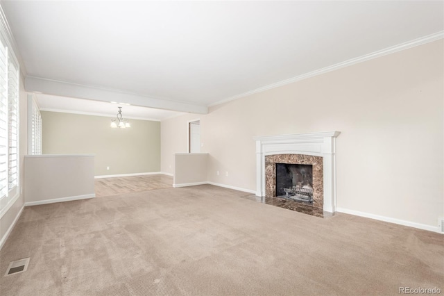 3 Glenview Dr, Littleton, CO 80123 - unfurnished living room featuring carpet floors, ornamental molding, a fireplace, a chandelier, and baseboards