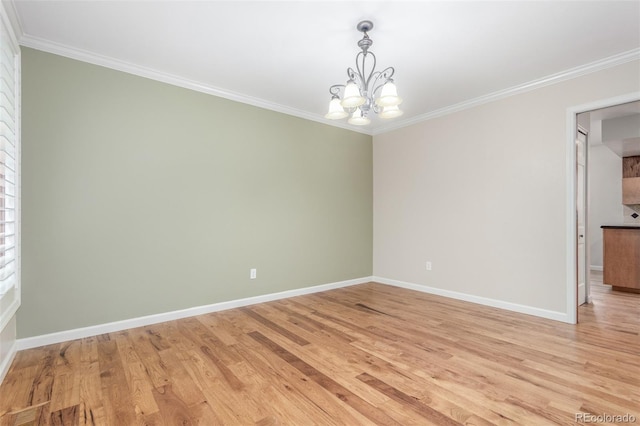3 Glenview Dr, Littleton, CO 80123 - unfurnished room with a chandelier, ornamental molding, baseboards, and light wood-style flooring