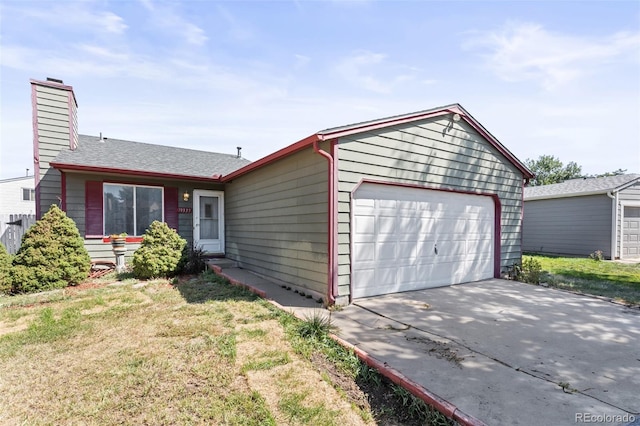 single story home featuring a garage and a front yard