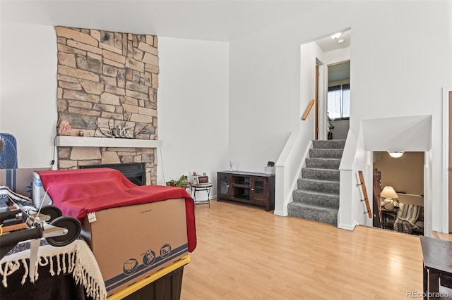 living room featuring hardwood / wood-style flooring and a fireplace