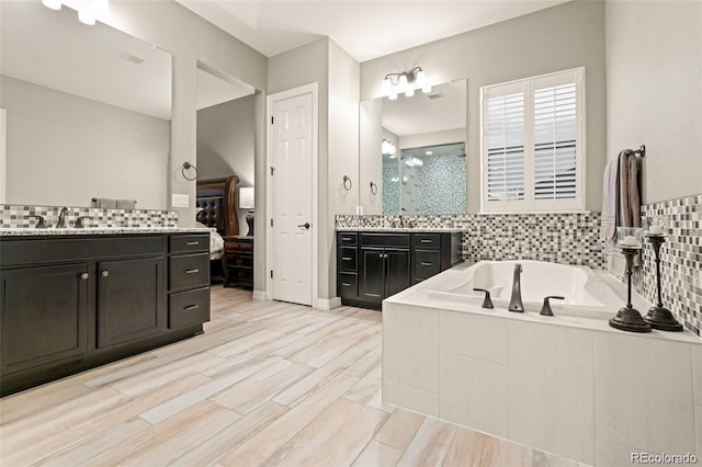 23696 E Del Norte Pl, Aurora, CO 80016 - bathroom with a stall shower, vanity, and a garden tub