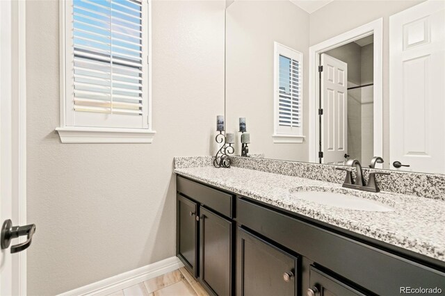 23696 E Del Norte Pl, Aurora, CO 80016 - bathroom featuring vanity and baseboards
