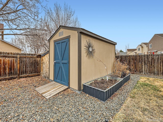 view of shed featuring a fenced backyard