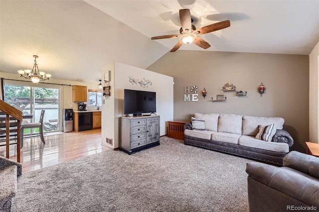 11395 E 116th Dr, Commerce City, CO 80640 - living area featuring a chandelier, ceiling fan, lofted ceiling, and light colored carpet