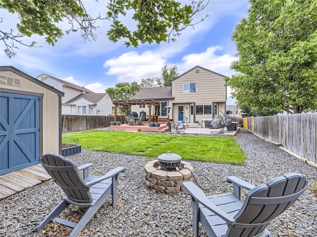 11395 E 116th Dr, Commerce City, CO 80640 - back of property with a fire pit, a deck, a pergola, and a patio area