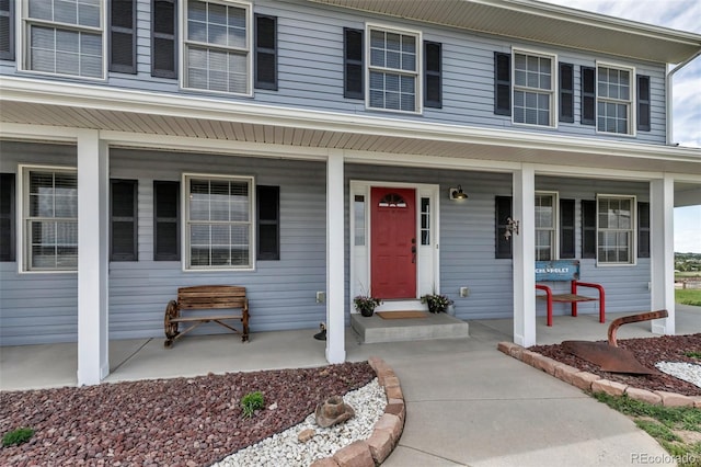 entrance to property featuring a porch