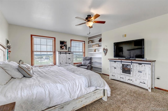 bedroom featuring carpet floors, a ceiling fan, and baseboards