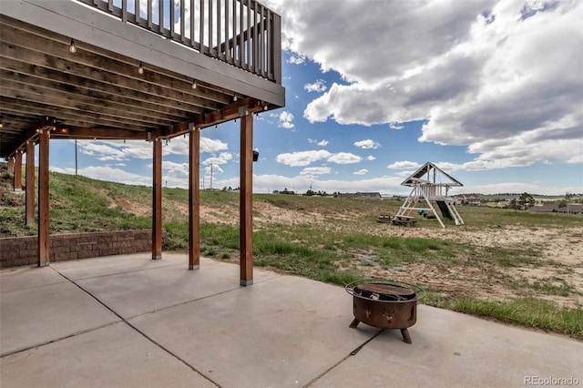 view of patio featuring a playground