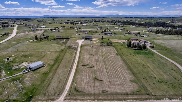 view of property location featuring rural landscape and a mountain backdrop