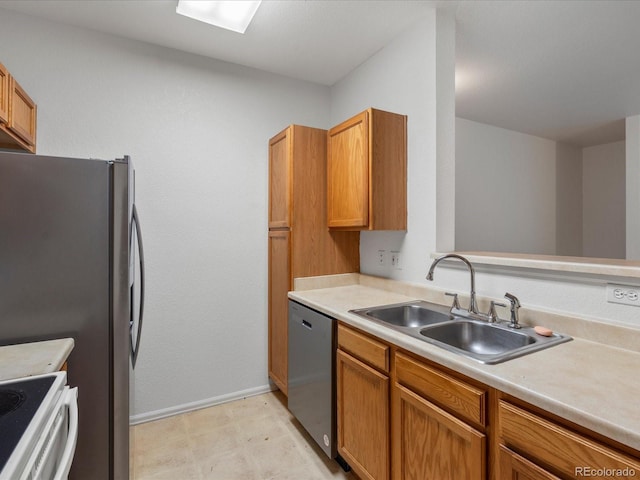 kitchen with stainless steel dishwasher, a sink, baseboards, and light countertops