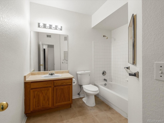 full bath featuring vanity, visible vents, toilet, baseboards, and washtub / shower combination