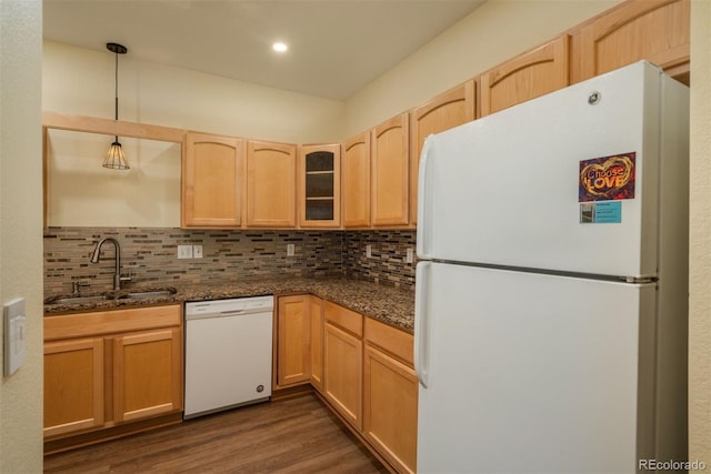 kitchen featuring pendant lighting, white appliances, light brown cabinets, decorative backsplash, and sink