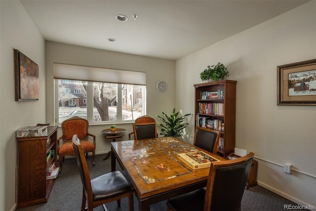 carpeted office space featuring baseboards