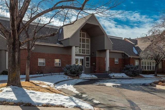 view of front of house featuring brick siding