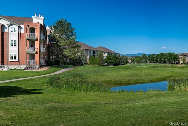 2896 W Riverwalk Cir Unit 204, Littleton, CO 80123 - view of home's community featuring a yard and a water and mountain view