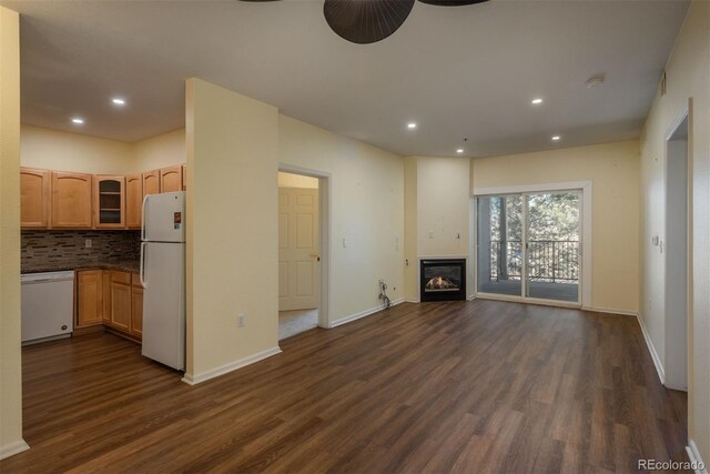 2896 W Riverwalk Cir Unit 204, Littleton, CO 80123 - unfurnished living room with a ceiling fan, dark wood-type flooring, recessed lighting, and a glass covered fireplace
