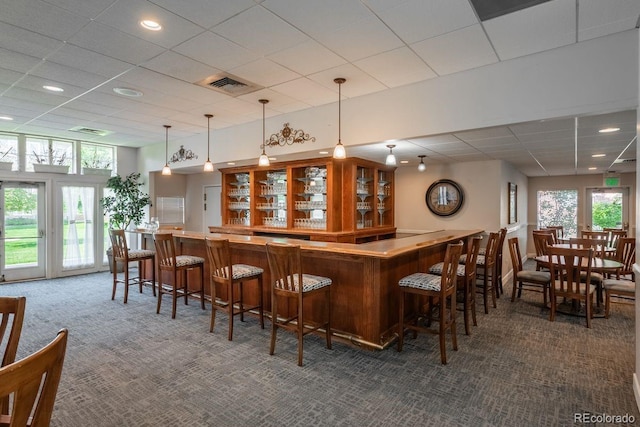 2896 W Riverwalk Cir Unit 204, Littleton, CO 80123 - indoor dry bar featuring carpet flooring, recessed lighting, decorative light fixtures, and a drop ceiling