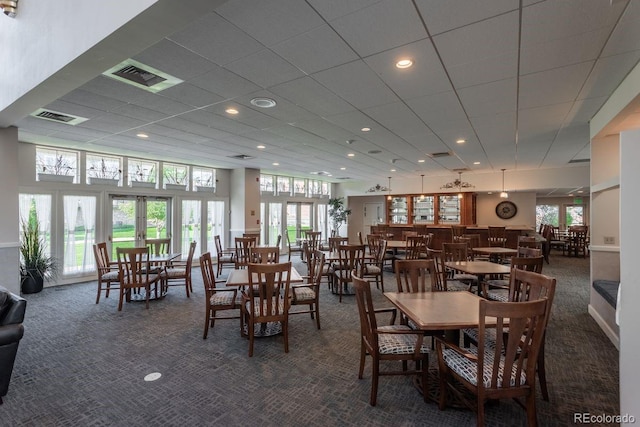2896 W Riverwalk Cir Unit 204, Littleton, CO 80123 - dining room with dark colored carpet and recessed lighting