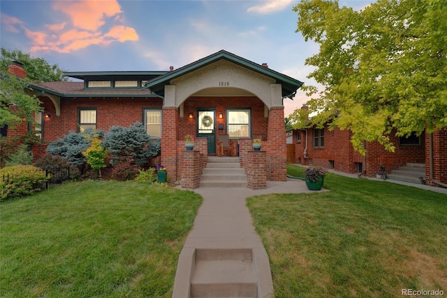 1215 Jackson St, Denver, CO 80206 - view of front of home featuring a front yard and brick siding
