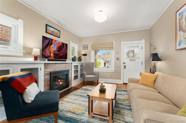 1215 Jackson St, Denver, CO 80206 - living area with a stone fireplace, ornamental molding, and wood finished floors