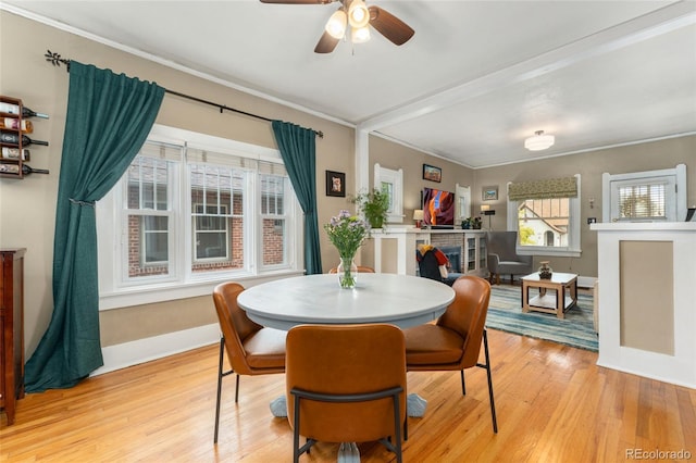 1215 Jackson St, Denver, CO 80206 - dining room featuring light wood-style floors, crown molding, and ceiling fan