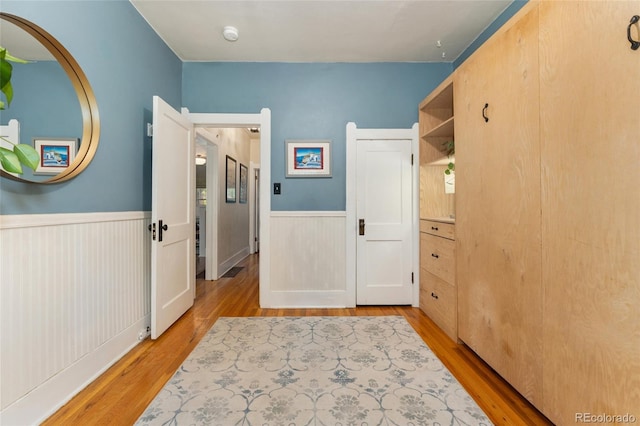 1215 Jackson St, Denver, CO 80206 - hallway with wainscoting and light wood-type flooring