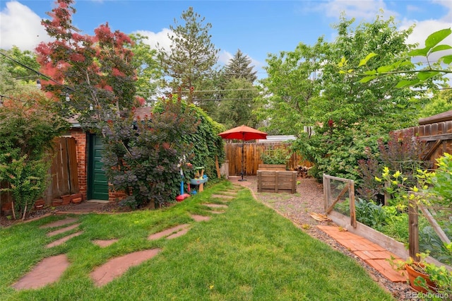 1215 Jackson St, Denver, CO 80206 - fenced backyard with a vegetable garden