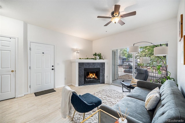 4451 S Ammons St Unit 4-108, Littleton, CO 80123 - living area featuring ceiling fan and a tiled fireplace