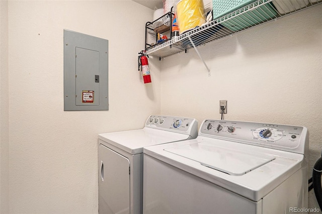 4451 S Ammons St Unit 4-108, Littleton, CO 80123 - clothes washing area with electric panel and washer and dryer