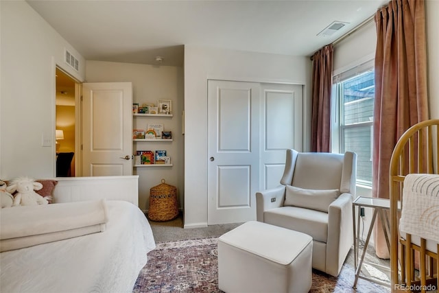 carpeted bedroom with a closet