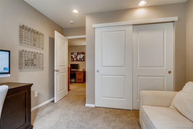 sitting room with light colored carpet