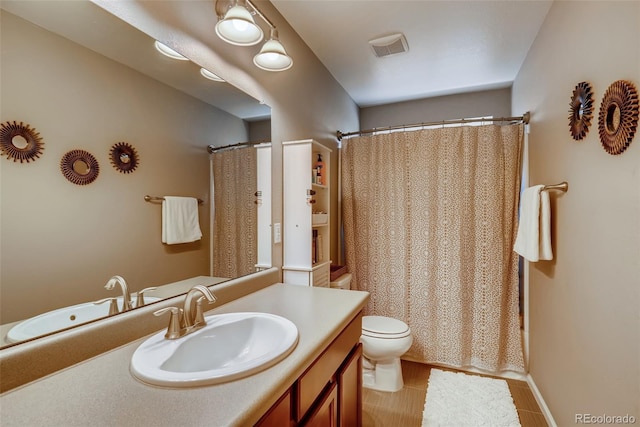 full bathroom with toilet, vanity, and shower / bath combination with curtain