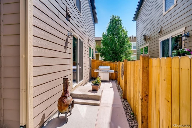 view of side of home with a patio area