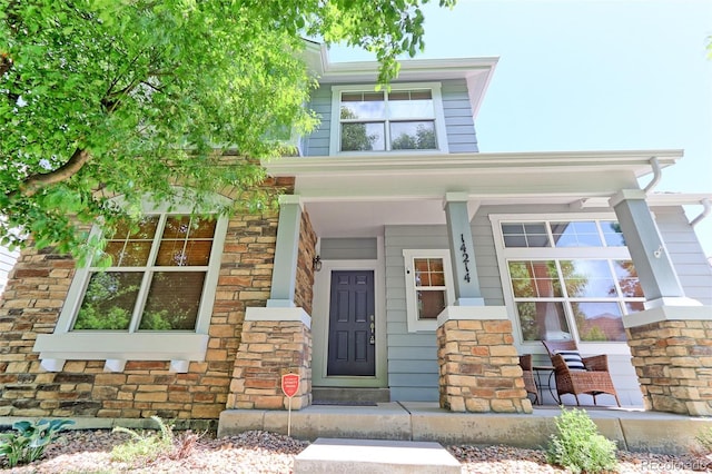 14214 Lakeview Ln, Broomfield, CO 80023 - view of front of house with stone siding and covered porch