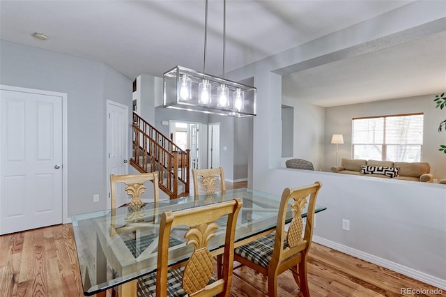 14214 Lakeview Ln, Broomfield, CO 80023 - dining area with stairway, wood finished floors, and baseboards