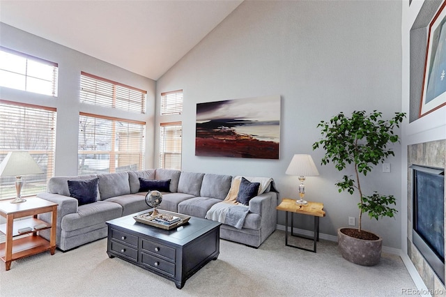 14214 Lakeview Ln, Broomfield, CO 80023 - living room with high vaulted ceiling, light colored carpet, a fireplace, and baseboards