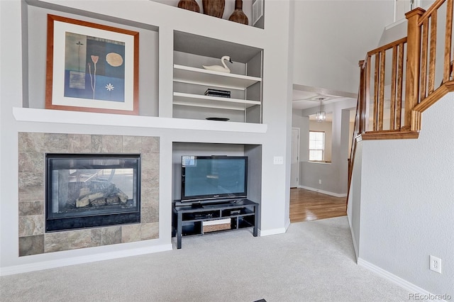14214 Lakeview Ln, Broomfield, CO 80023 - living area with baseboards, carpet flooring, and built in shelves
