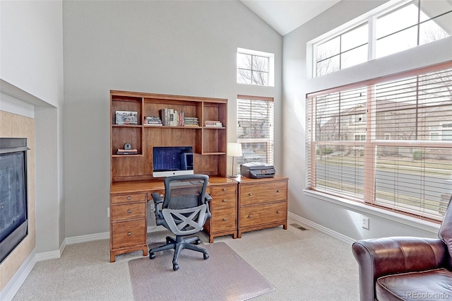14214 Lakeview Ln, Broomfield, CO 80023 - office area with light colored carpet, high vaulted ceiling, baseboards, and a fireplace