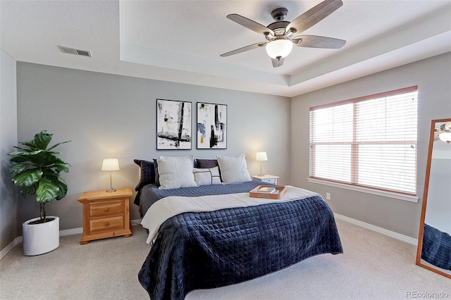 14214 Lakeview Ln, Broomfield, CO 80023 - carpeted bedroom featuring a tray ceiling, baseboards, and ceiling fan