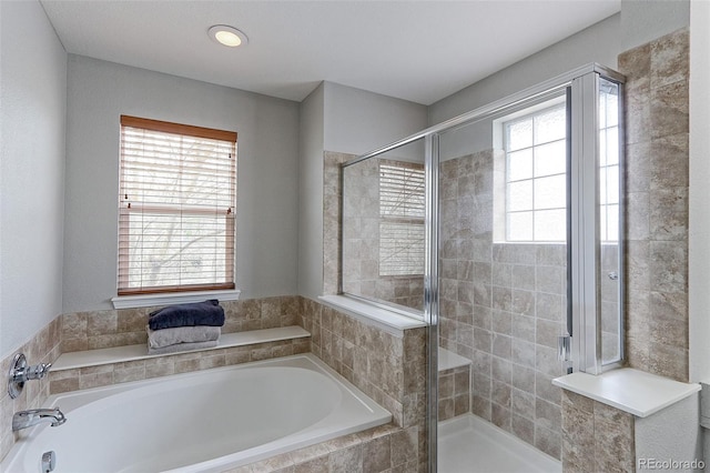 14214 Lakeview Ln, Broomfield, CO 80023 - full bathroom with healthy amount of natural light, a bath, and a shower stall