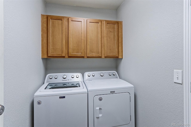 14214 Lakeview Ln, Broomfield, CO 80023 - washroom with cabinet space and independent washer and dryer