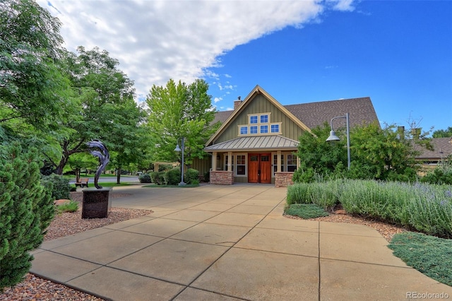 14214 Lakeview Ln, Broomfield, CO 80023 - craftsman inspired home with board and batten siding, a porch, and stone siding