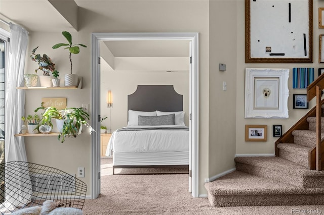 carpeted bedroom featuring baseboards