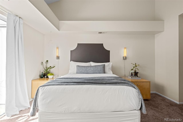 bedroom with carpet flooring, visible vents, and baseboards