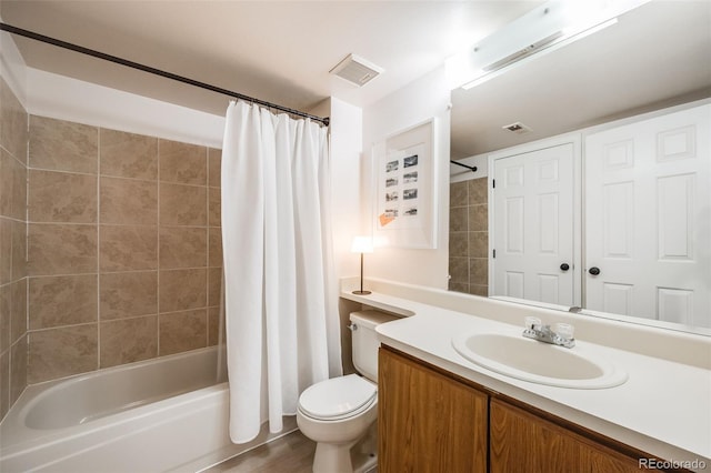 bathroom with toilet, visible vents, shower / tub combo with curtain, and vanity