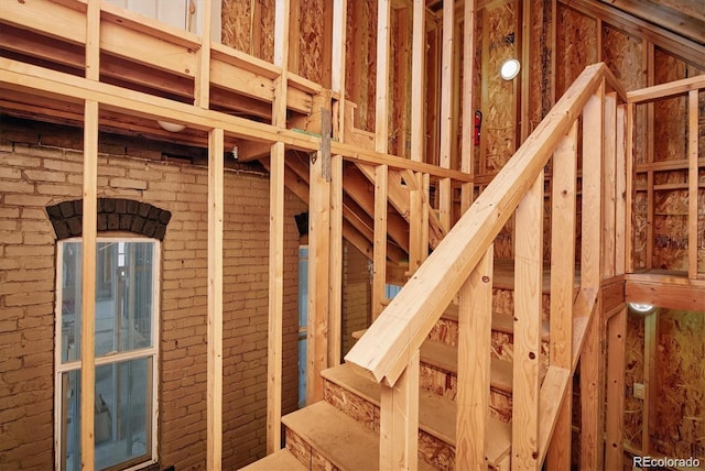 miscellaneous room with brick wall