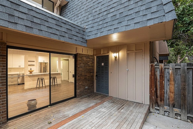 wooden deck featuring fence