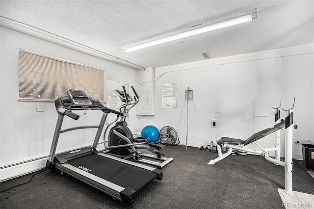 exercise area with a textured ceiling