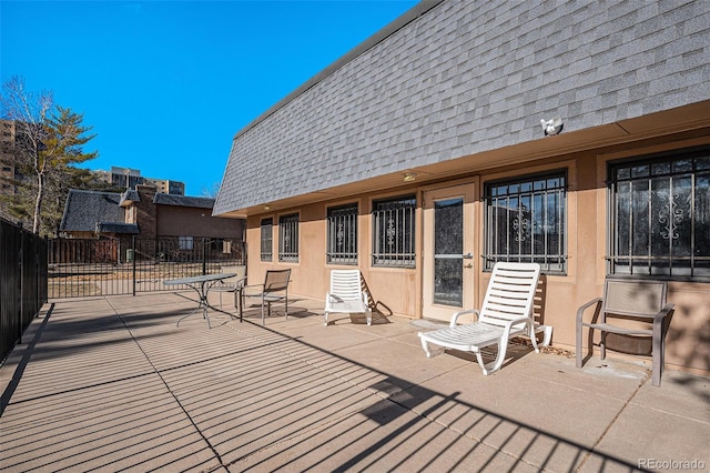 wooden deck with a patio area and fence